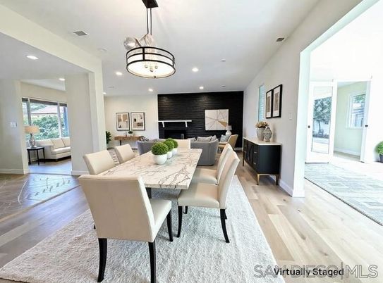 Dining room, Fireplace, Interior, Living room, Pendant Lights, Recessed Lighting, Wood Texture Flooring