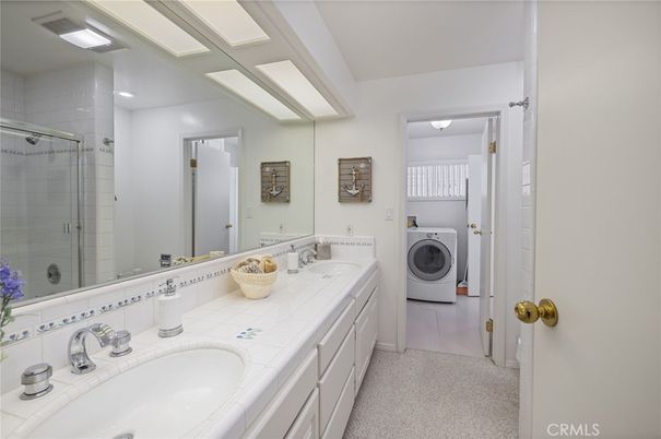 Bathroom, Dual Sink Vanities, Glass Shower, Interior, Recessed Lighting, Tile Countertops, Washer