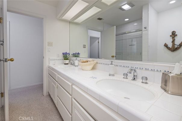 Bathroom, Dual Sink Vanities, Glass Shower, Interior, Recessed Lighting, Tile Countertops