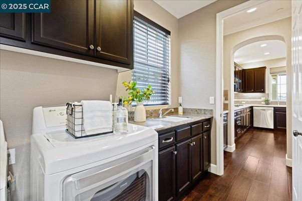 Interior, Kitchen, Recessed Lighting, Washer, Wood Texture Flooring