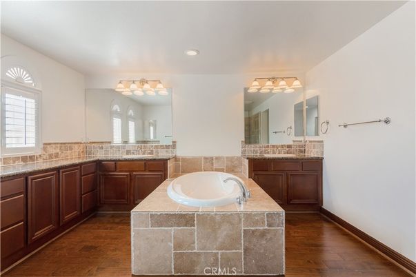 Bathroom, Dual Sink Vanities, Interior, Recessed Lighting, Tile Countertops, Wood Texture Flooring