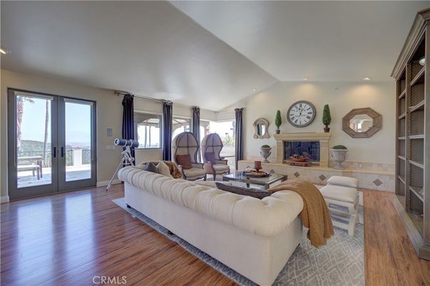 Fireplace, Fitness Equipment, Interior, Living room, Recessed Lighting, Wood Texture Flooring