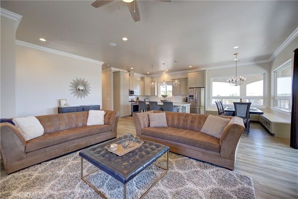 Chandelier, Dining room, Interior, Kitchen, Living room, Pendant Lights, Recessed Lighting, Stainless Steel Appliances, Wood Texture Flooring
