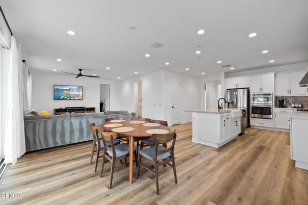 Dining room, Interior, Kitchen, Living room, Recessed Lighting, Stainless Steel Appliances, Wood Texture Flooring