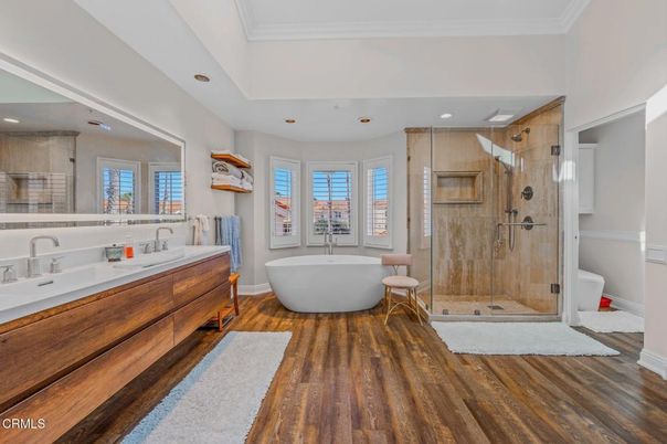 Bathroom, Dual Sink Vanities, Free Standing Baths, Glass Shower, Interior, Recessed Lighting, Wood Texture Flooring