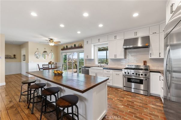 Dining room, Interior, Kitchen, Recessed Lighting, Stainless Steel Appliances, Wood Texture Flooring