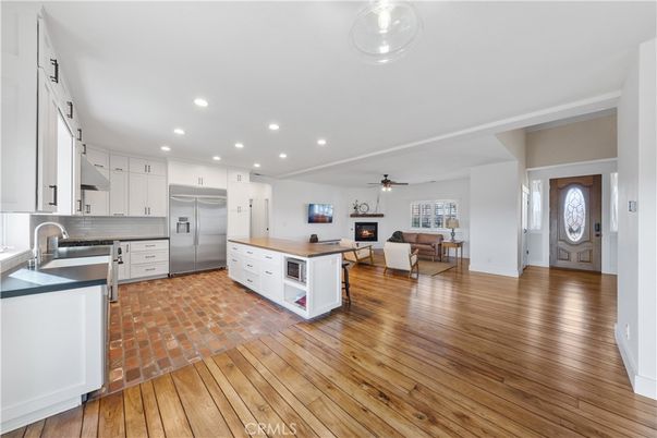 Dining room, Interior, Kitchen, Living room, Recessed Lighting, Stainless Steel Appliances, Wood Texture Flooring