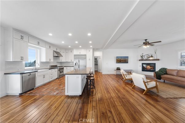 Fireplace, Interior, Kitchen, Living room, Recessed Lighting, Stainless Steel Appliances, Wood Texture Flooring
