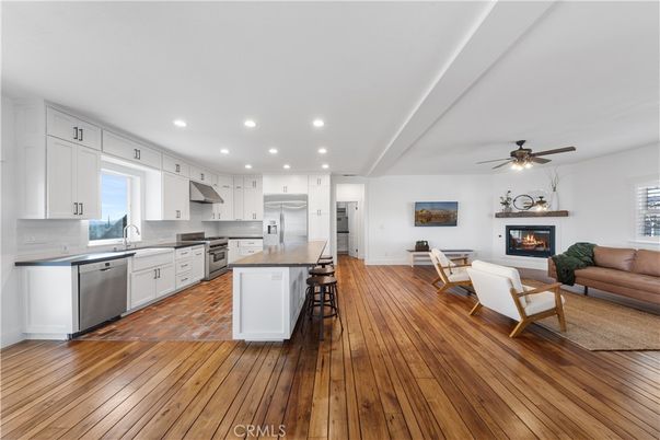 Fireplace, Interior, Kitchen, Living room, Recessed Lighting, Stainless Steel Appliances, Wood Texture Flooring