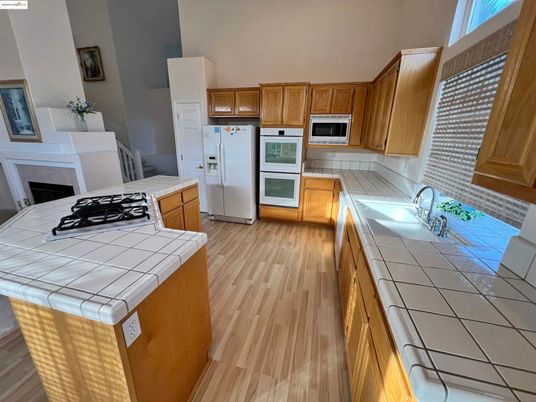 Interior, Kitchen, Tile Countertops, Wood Texture Flooring
