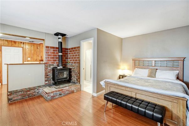 Bedroom, Fireplace, Interior, Stone Walls, Wood Texture Flooring