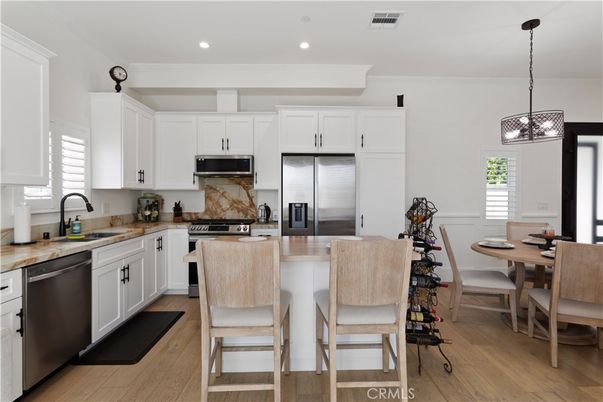 Dining room, Interior, Kitchen, Pendant Lights, Recessed Lighting, Stainless Steel Appliances, Wood Texture Flooring