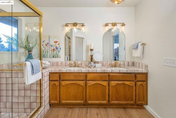 Bathroom, Dual Sink Vanities, Glass Shower, Interior, Tile Countertops, Wood Texture Flooring