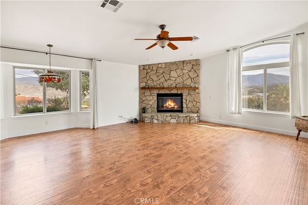 Empty room, Fireplace, Interior, Pendant Lights, Stone Walls, Wood Texture Flooring