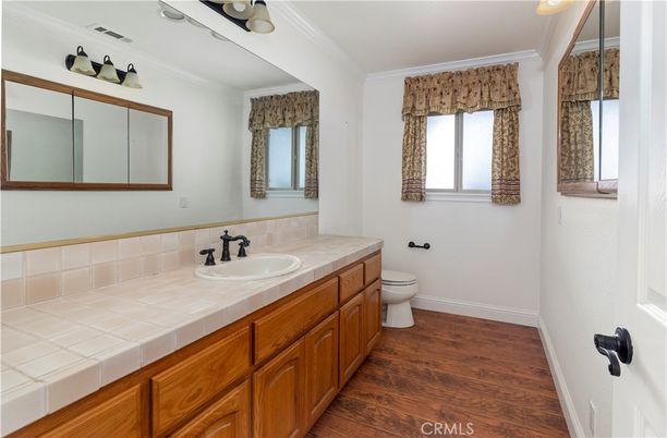 Bathroom, Dual Sink Vanities, Interior, Tile Countertops, Wood Texture Flooring