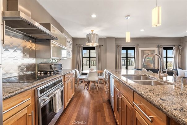 Dining room, Interior, Kitchen, Pendant Lights, Recessed Lighting, Stainless Steel Appliances, Wood Texture Flooring
