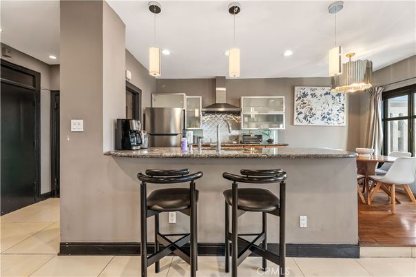 Dining room, Interior, Kitchen, Pendant Lights, Recessed Lighting, Stainless Steel Appliances, Wood Texture Flooring