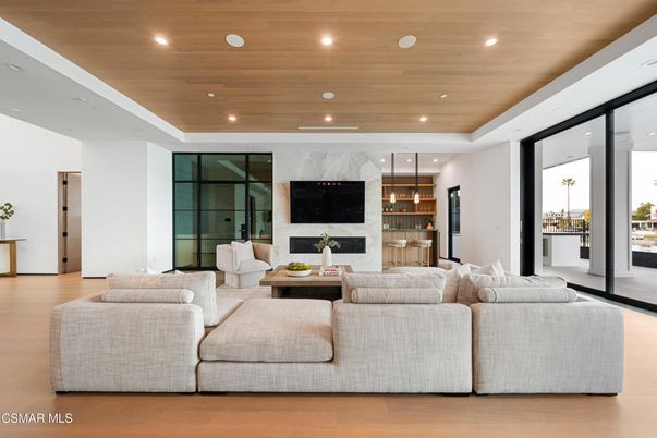 Fireplace, Interior, Living room, Marble Walls, Pendant Lights, Recessed Lighting, Wooden Ceilings, Wood Texture Flooring