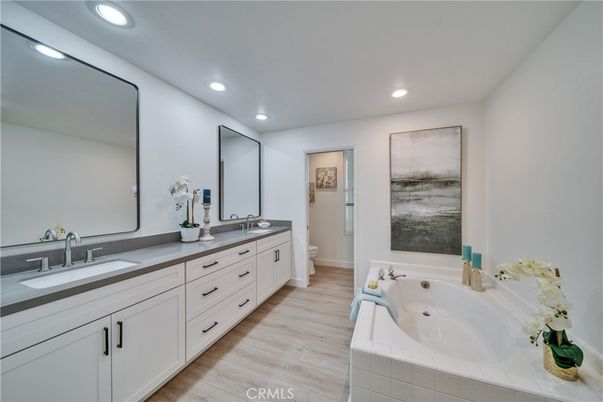 Bathroom, Dual Sink Vanities, Interior, Recessed Lighting, Wood Texture Flooring