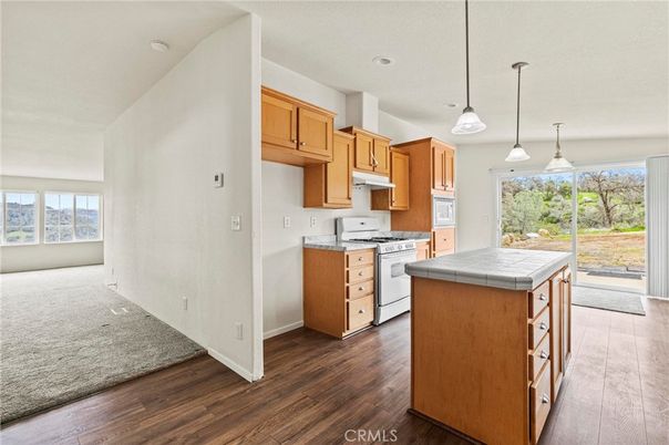Interior, Kitchen, Pendant Lights, Recessed Lighting, Tile Countertops, Wood Texture Flooring