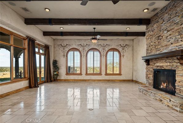 Empty room, Fireplace, Interior, Recessed Lighting, Stone Walls, Wooden Beams