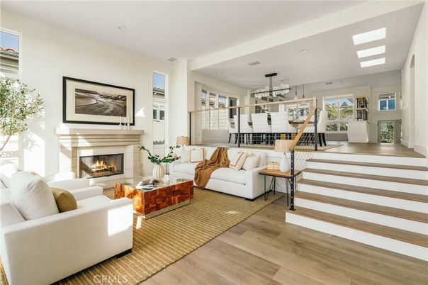 Dining room, Fireplace, Interior, Living room, Pendant Lights, Recessed Lighting, Wood Texture Flooring