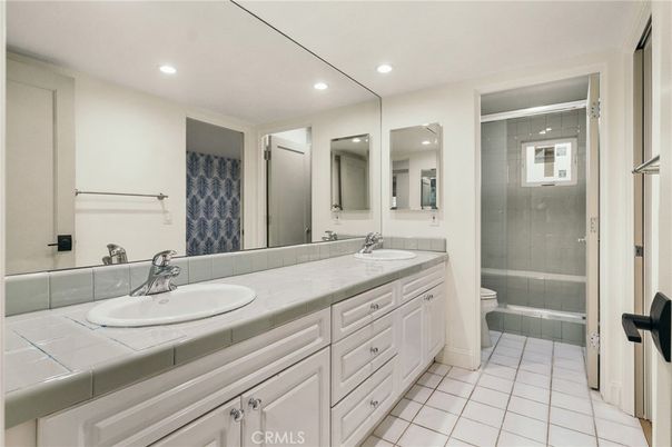 Bathroom, Dual Sink Vanities, Glass Shower, Interior, Recessed Lighting, Tile Countertops