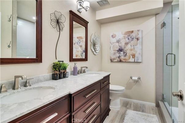 Bathroom, Dual Sink Vanities, Glass Shower, Interior, Wood Texture Flooring