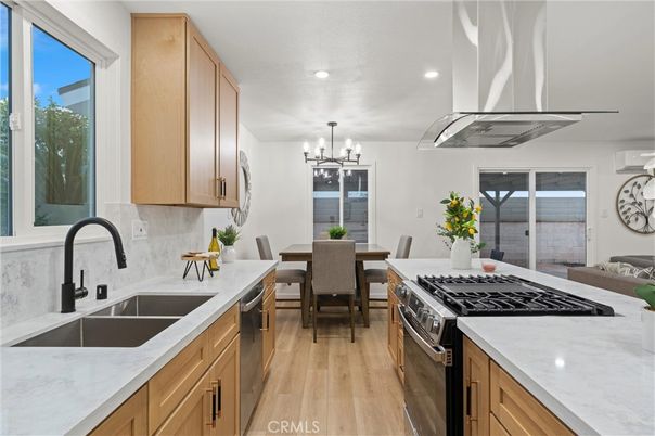 Chandelier, Dining room, Interior, Kitchen, Recessed Lighting, Stainless Steel Appliances, Wood Texture Flooring