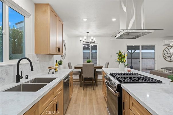 Chandelier, Dining room, Interior, Kitchen, Recessed Lighting, Stainless Steel Appliances, Wood Texture Flooring