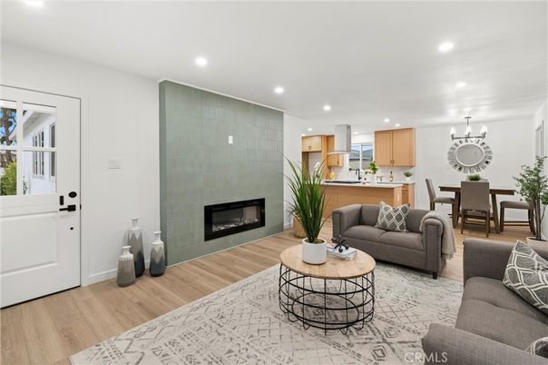 Chandelier, Dining room, Fireplace, Interior, Kitchen, Living room, Recessed Lighting, Wood Texture Flooring