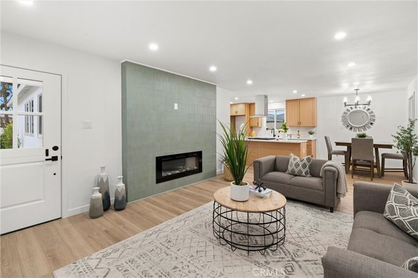Chandelier, Dining room, Fireplace, Interior, Kitchen, Living room, Recessed Lighting, Wood Texture Flooring