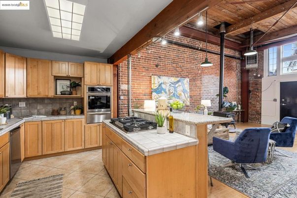 Interior, Kitchen, Pendant Lights, Stainless Steel Appliances, Stone Walls, Tile Countertops, Wooden Beams, Wooden Ceilings, Wood Texture Flooring