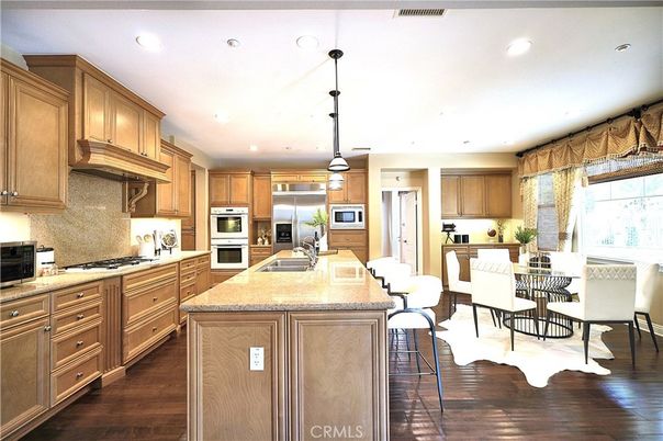 Dining room, Interior, Kitchen, Pendant Lights, Recessed Lighting, Stainless Steel Appliances, Wood Texture Flooring