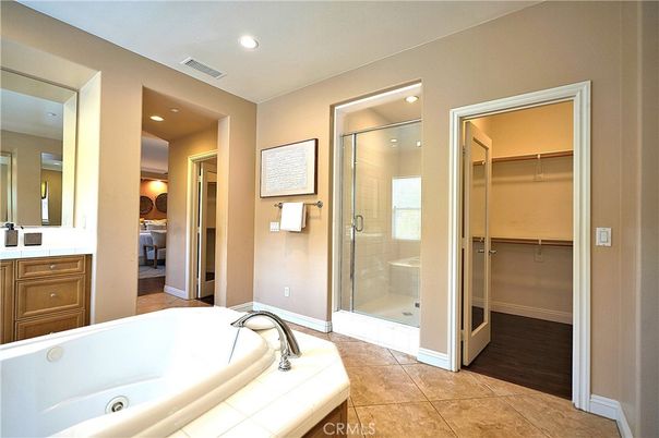 Bathroom, Glass Shower, Interior, Recessed Lighting, Tile Countertops, Walk-in Closets, Wood Texture Flooring