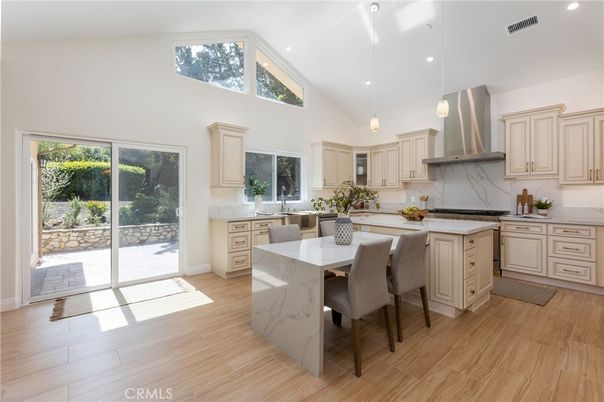 Interior, Kitchen, Marble Walls, Pendant Lights, Recessed Lighting, Stainless Steel Appliances, Wood Texture Flooring