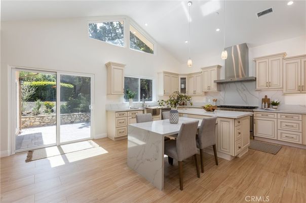 Dining room, Interior, Kitchen, Marble Walls, Pendant Lights, Recessed Lighting, Stainless Steel Appliances, Wood Texture Flooring