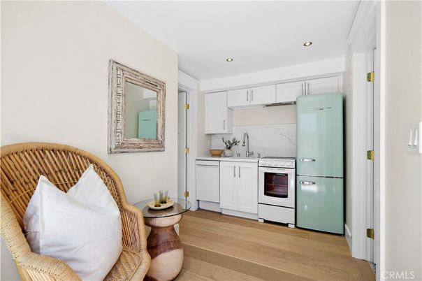 Interior, Kitchen, Marble Walls, Recessed Lighting, Stainless Steel Appliances, Wood Texture Flooring