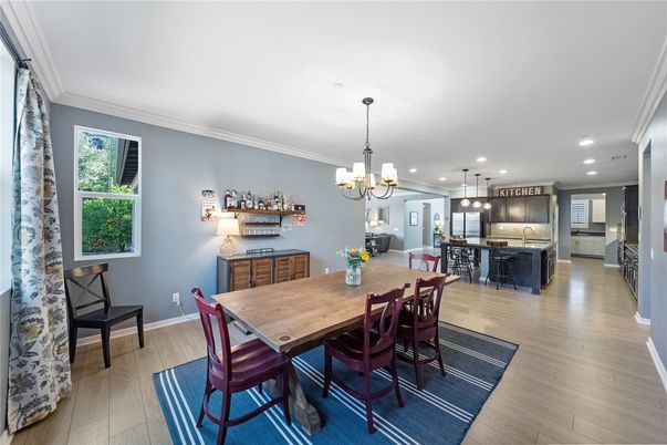 Chandelier, Dining room, Interior, Kitchen, Pendant Lights, Recessed Lighting, Stainless Steel Appliances, Wood Texture Flooring