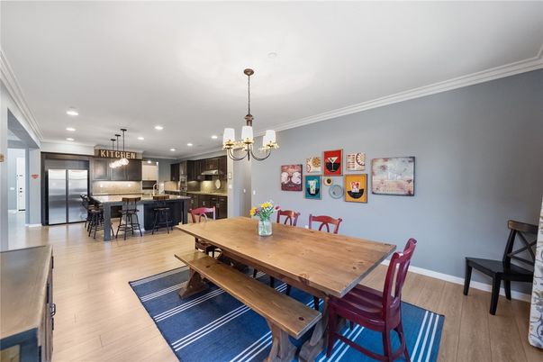 Chandelier, Dining room, Interior, Kitchen, Pendant Lights, Recessed Lighting, Stainless Steel Appliances, Wood Texture Flooring