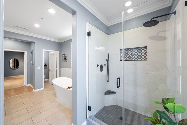 Bathroom, Free Standing Baths, Glass Shower, Interior, Recessed Lighting, Wood Texture Flooring