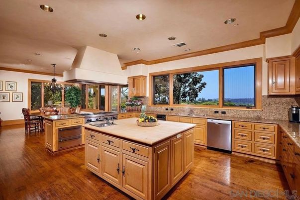 Chandelier, Dining room, Interior, Kitchen, Pendant Lights, Recessed Lighting, Stainless Steel Appliances, Wood Texture Flooring