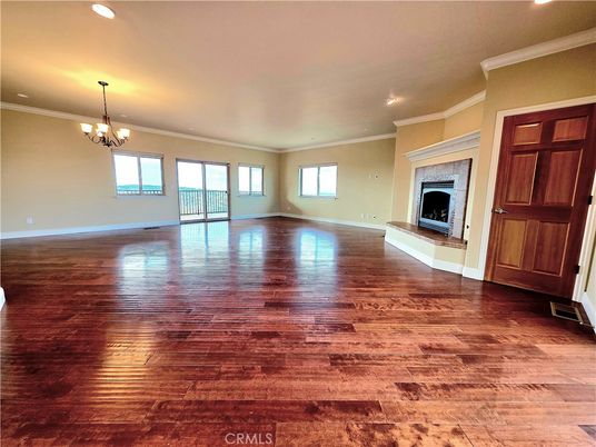 Chandelier, Empty room, Fireplace, Interior, Recessed Lighting, Wood Texture Flooring