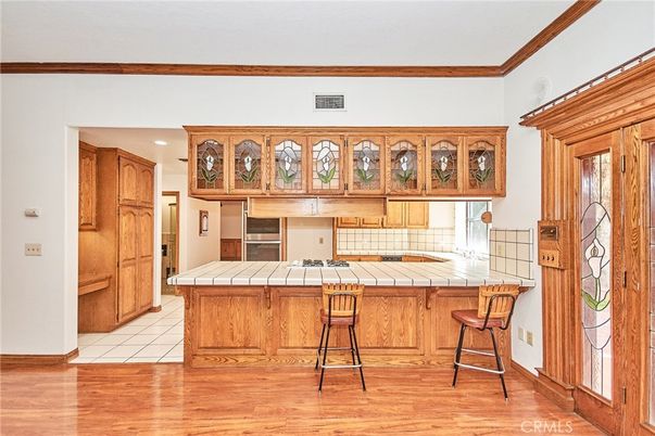 Interior, Kitchen, Recessed Lighting, Tile Countertops, Wood Texture Flooring