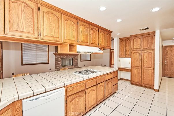 Fireplace, Interior, Kitchen, Recessed Lighting, Tile Countertops