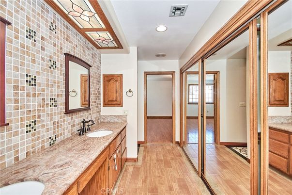 Bathroom, Dual Sink Vanities, Interior, Recessed Lighting, Wood Texture Flooring