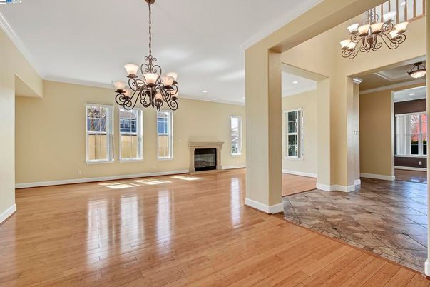 Chandelier, Empty room, Fireplace, Interior, Recessed Lighting, Wood Texture Flooring