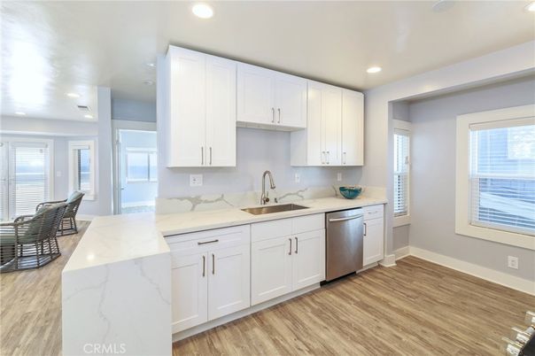Dining room, Interior, Kitchen, Recessed Lighting, Stainless Steel Appliances, Wood Texture Flooring