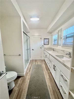 Bathroom, Dual Sink Vanities, Glass Shower, Interior, Wood Texture Flooring