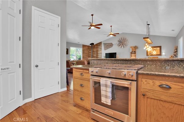 Interior, Kitchen, Pendant Lights, Stainless Steel Appliances, Stone Walls, Wood Texture Flooring